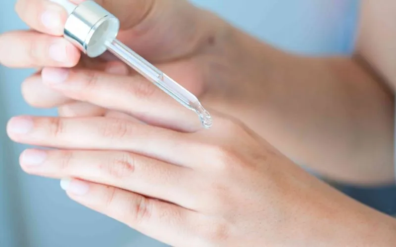 Vitamin C Brightening Treatment in San Antonio, TX Women Applying Vitamin Serum by Flawless Laser